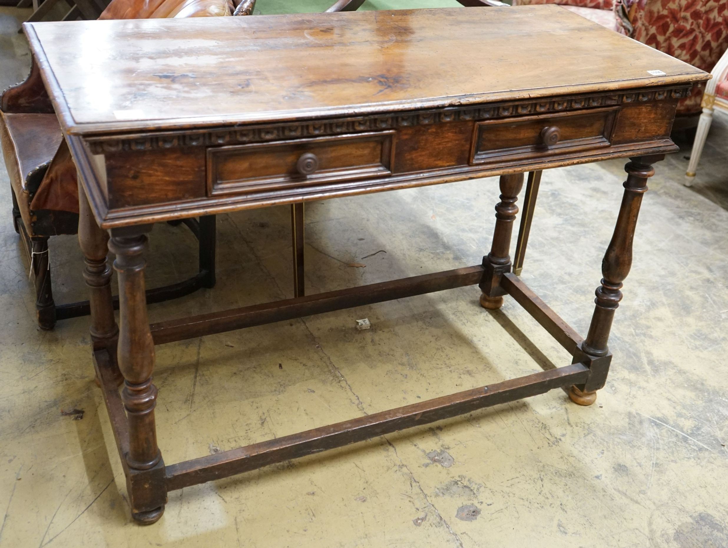 A Tuscan style walnut hall table with frieze drawers over turned legs united by stretchers, width 120cm, depth 55cm, height 85cm